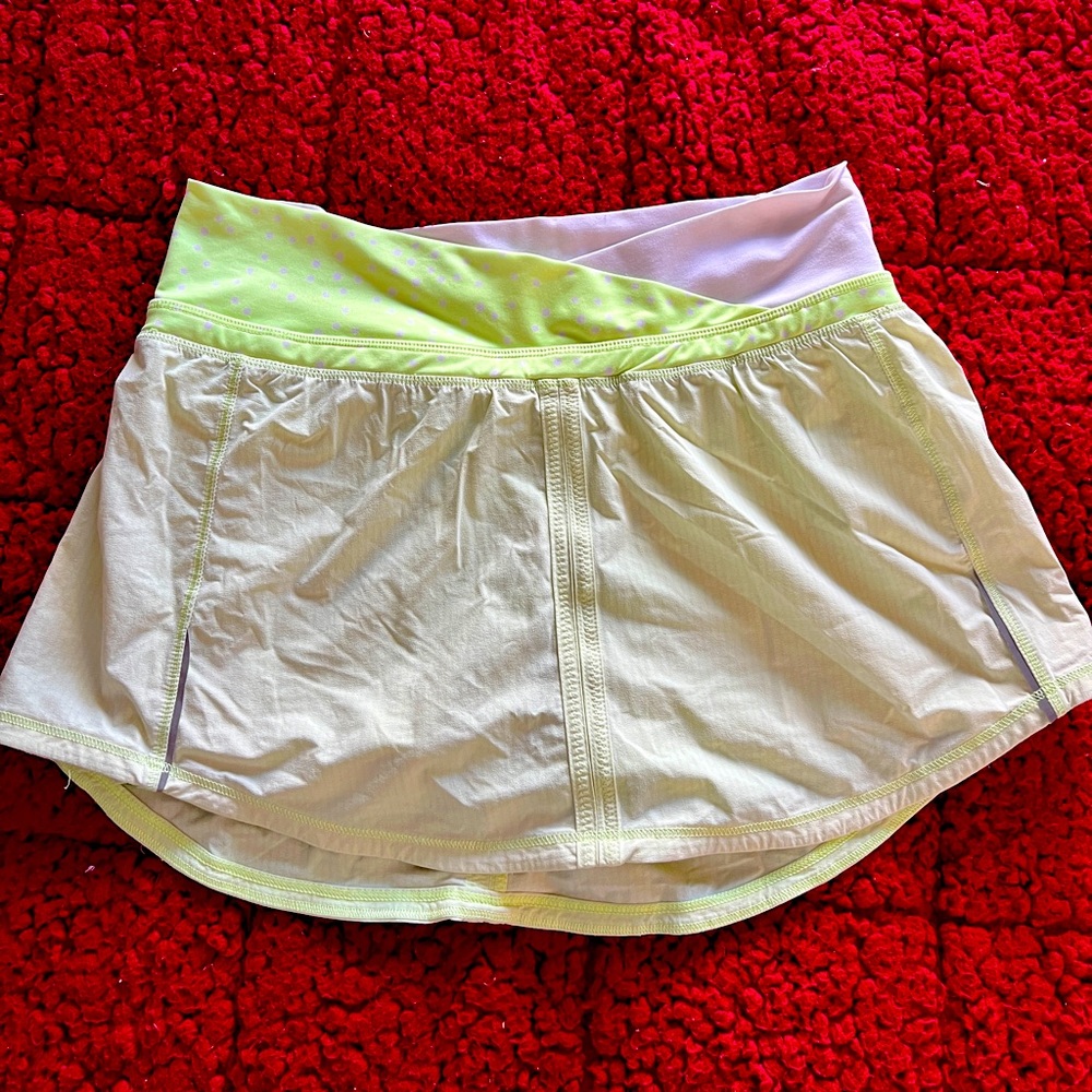 Lime green with polka dots Lululemon tennis skirt with shorts.